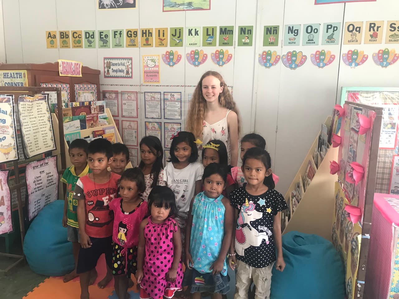 Natalia with a group of children at a Reading Nook