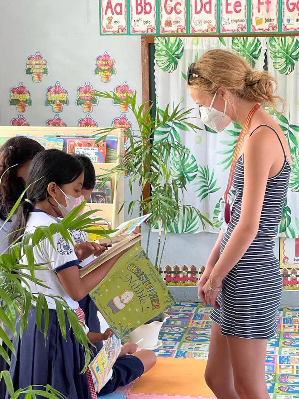 Natalia watching children read their books